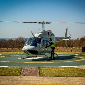 Helicopter preparing for departure from the helipad in Victoria Falls
