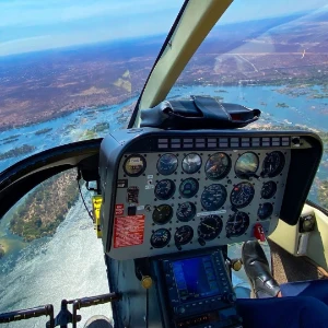 View over the helicopter cockpit during a scenic flight in Victoria Falls