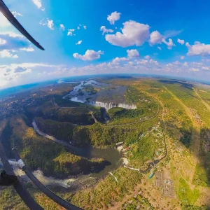 Wide aerial view of Victoria Falls and Batoka Gorge from a helicopter